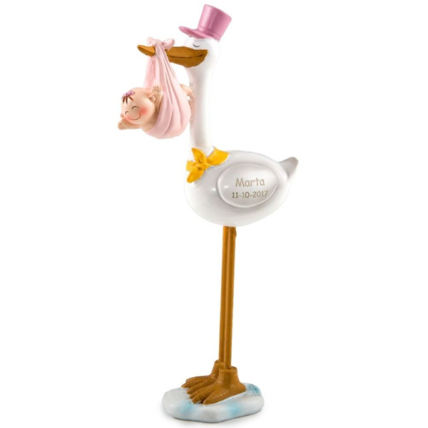 Figura de pastel de cigüeña con bebé y gorro rosa